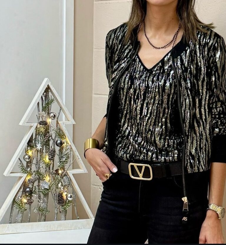 Vestido elegante i moderno de color negro i detalles dorados